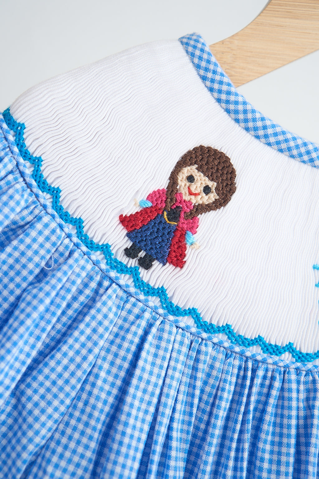 Blue snow princess hand smocked gingham dress